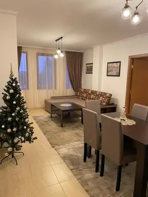 a living room with a christmas tree in it at Гранд Манастира , Пампорово in Pamporovo