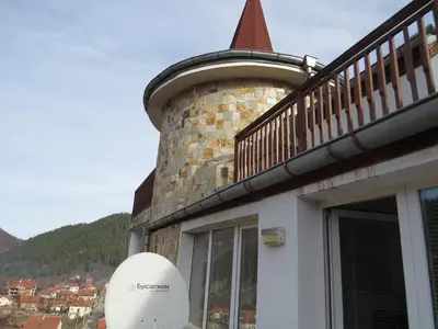 a building with a balcony on the side of it at Panoramic Apartment 301 in Eagle Rock Complex in Beli Iskar