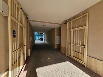 an empty hallway of a building with a gate at Brand new apartment with free parking near city center in Sofia