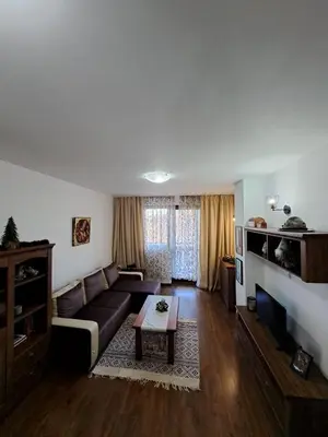 a living room with a couch and a table at Winslow Highland Bansko - Apartment Giovanni, ул Валевица 7 кв Грамадето in Bansko