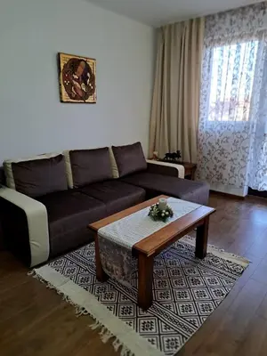 a living room with a couch and a coffee table at Winslow Highland Bansko - Apartment Giovanni, ул Валевица 7 кв Грамадето in Bansko