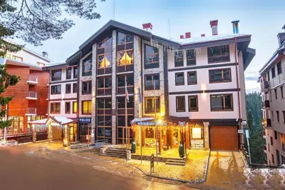 a large building with a store in front of it at 1 Bedroom cozy flat in Pamporovo