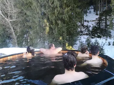 a group of people in a swimming pool at GORA - Вила Villa for 22 Guests, Пампорово, Rhodope Mountains in Progled