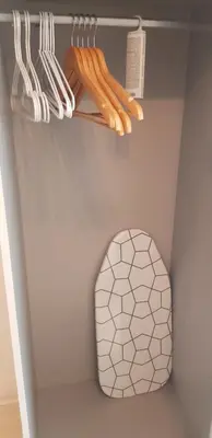a room with a closet with a toilet and utensils at Karastoyanovi's Apartment in Sofia