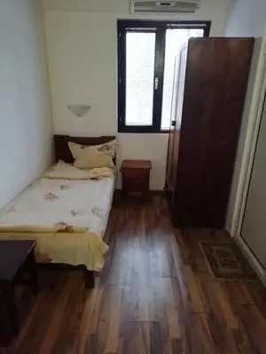 a small room with a bed and a window at ХАН КОСТИНА - HAN KOSTINA in Ribarica