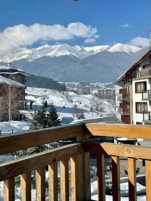 a balcony with a view of snow covered mountains at Studio Chalet 13, St John Park Bansko in Bansko