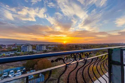a view of a sunset from a balcony at Beautiful 1BD Apartment with a Parking Spot by Flat Mаnager in Plovdiv