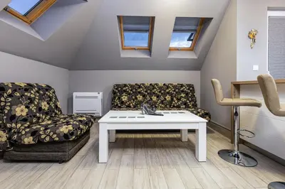 a living room with a couch and a table at Beautiful 1BD Apartment with a Parking Spot by Flat Mаnager in Plovdiv