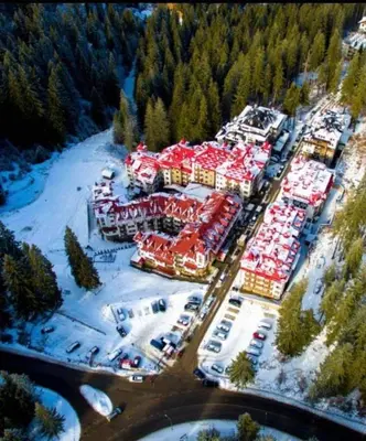 an aerial view of a large parking lot with cars at Pamporovo Apartment The Castle in Pamporovo
