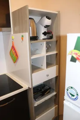 a kitchen with white shelves and a refrigerator at Winter Аpartments Gerovi in Pamporovo