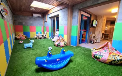 a room with some toys on the grass at BOUTIQUE Hotel ENTRY E in Bansko