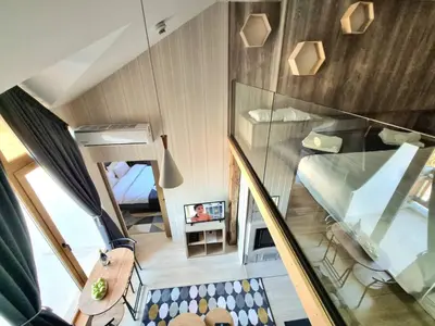 an overhead view of a room with a staircase and a bedroom at BOUTIQUE Hotel ENTRY E in Bansko
