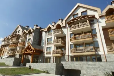 a large apartment building with balconies on it at Premium Apartments Bansko in Bansko