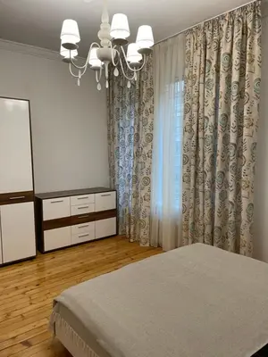 a bedroom with a bed and a dresser and a mirror at Parchevich 26 Apartment - 24h Self Check-in in Sofia