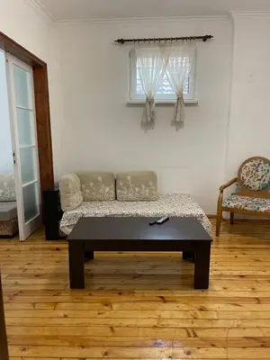 a living room with a couch and a window at Parchevich 26 Apartment - 24h Self Check-in in Sofia