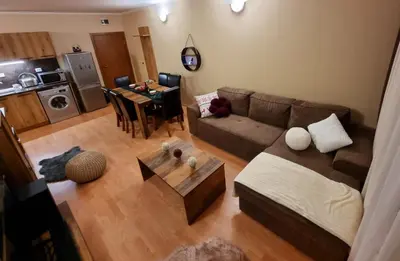 a living room with a couch and a table at Borovets Sequoia2 Apartment no 5 in Borovets