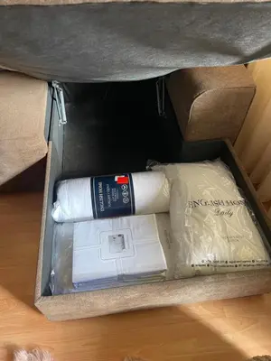 a box with a book and a bottle in it at Borovets Sequoia2 Apartment no 5 in Borovets