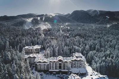 an aerial view of a resort with snow covered trees at Hashtag Studio Borovets in Borovets