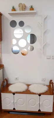 a room with a bench with white walls and shelves at Apartments KaVi , Monastery 1 & 3, Grand Monastery,Pamporovo in Pamporovo