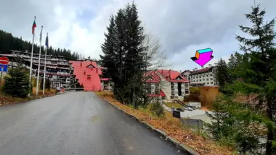 a kite flying in the air over a street at Apartments KaVi , Monastery 1 & 3, Grand Monastery,Pamporovo in Pamporovo