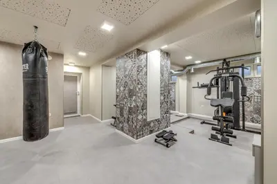 a gym with a punching bag in a room at R & R Apartments in Sofia