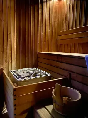 a wooden room with a tub and a toilet at Luxury private studio in Paradiso Verde in Bansko