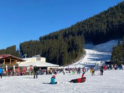 a group of people in the snow at a ski slope at Luxury private studio in Paradiso Verde in Bansko