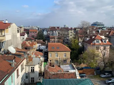 a view of a city with houses and roofs at Central and Spacious apartment in Sofia