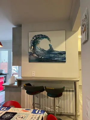 a room with a painting of a wave on the wall at Top Central Place with 2 bedrooms in Sofia in Sofia