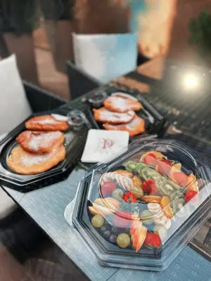 a table topped with trays of food and pastries at HIDDEN BANK: Digger's Dream in Plovdiv