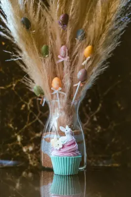 a glass vase with a cupcake and easter eggs at HIDDEN BANK: Digger's Dream in Plovdiv