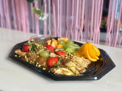 a plate of food with fruit on a table at HIDDEN BANK: Digger's Dream in Plovdiv