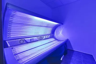 an empty refrigerator in a room with a purple light at Luxury Apartment in Belvedere Club Hotel in Bansko