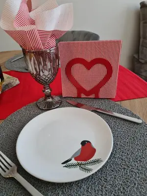 a plate with a bird on it on a table at Mountain Paradise in Aparthotel Borovets Gardens in Borovets