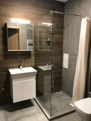 a bathroom with a glass shower and a sink at APARTHOTEL BON BON in Sofia