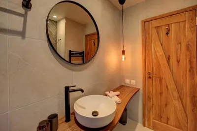 a bathroom with a white sink and a mirror at KOKICHE 4 Friends, Borovets in Borovets