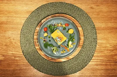 a plate of food on a wooden table at Downtown - Netflix - AC - Next to Metro and Train in Sofia