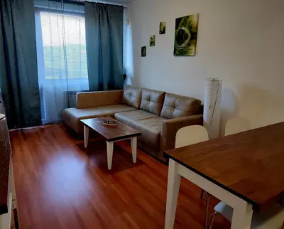 a living room with a couch and a table at Bansko Belvedere Apartments in Bansko