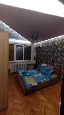 a bedroom with a bed and a television in it at Top center Art deluxe apartment near to Aleksander Nevsky cathedral in Sofia