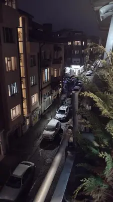 a city street with cars parked in a parking lot at Top center Art deluxe apartment near to Aleksander Nevsky cathedral in Sofia