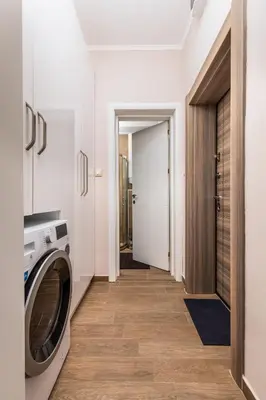 a laundry room with a washer and dryer at Stella 1&2 - Pink and Grey Studios near the Singing Fountains by Flat Mаnager in Plovdiv