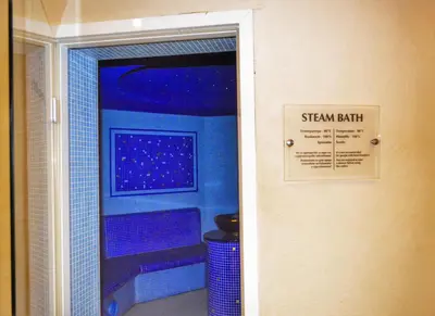 a sign on the door of a shower in a bathroom at Bellevue Residence RELAX ZONE in Bansko