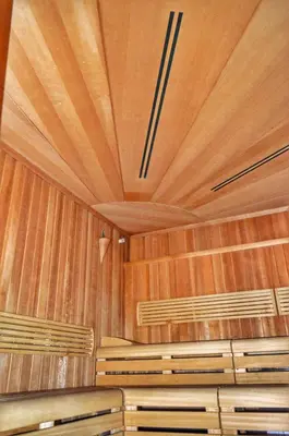 a room with wooden walls and wooden benches at Bellevue Residence RELAX ZONE in Bansko