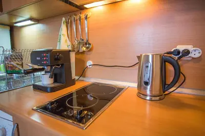 a kitchen with a coffee pot on a counter at Cozy Colorful Studio at the foot of the Mountain by Flat Mаnager in Bansko