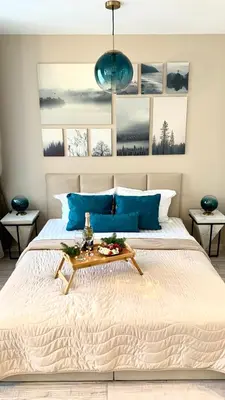 a bedroom with a bed with a table on it at MAGRI Luxurious Apartment A42 Borovets Gardens in Borovets