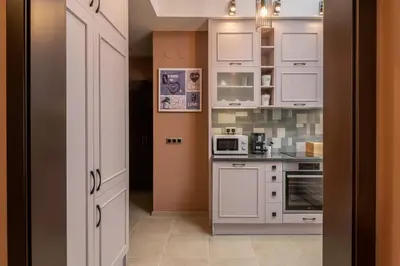 a kitchen with white cabinets and white appliances at ~Angels ~ Two-Bedroom Deluxe Flat in City Centre in Sofia