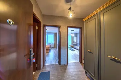 a hallway of a house with a door and a room at Colors of Nature in Stylish Flat in Pamporovo by Flat Mаnager in Pamporovo