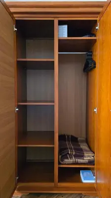 a wooden book shelf with a book in it at Bansko Boutique Apartments - Flora Boutique in Bansko