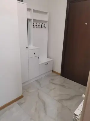 a room with white walls and a large marble floor at new apartment near city center with free parking in Sofia