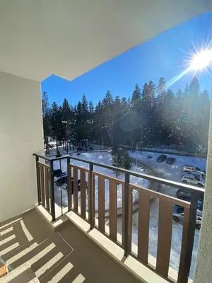 a balcony with a view of a parking lot at Borovets Gardens Ski Apartment in Borovets